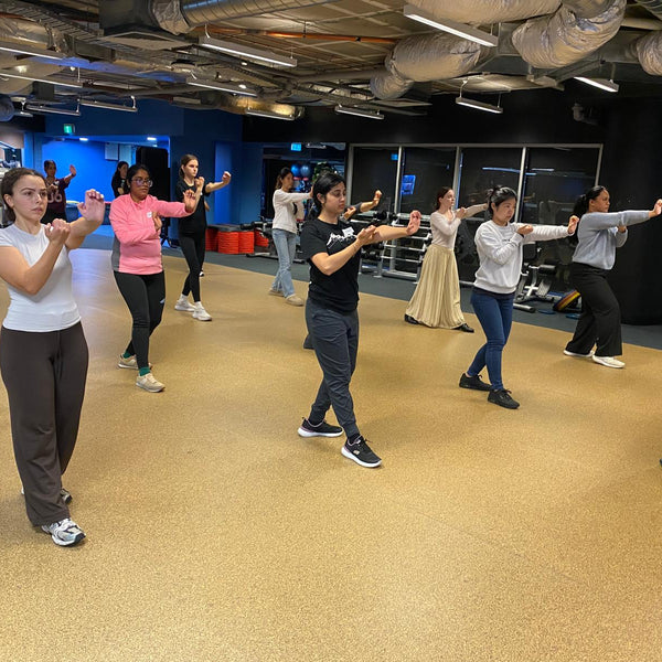 RMIT students performing a self-defence move during a class