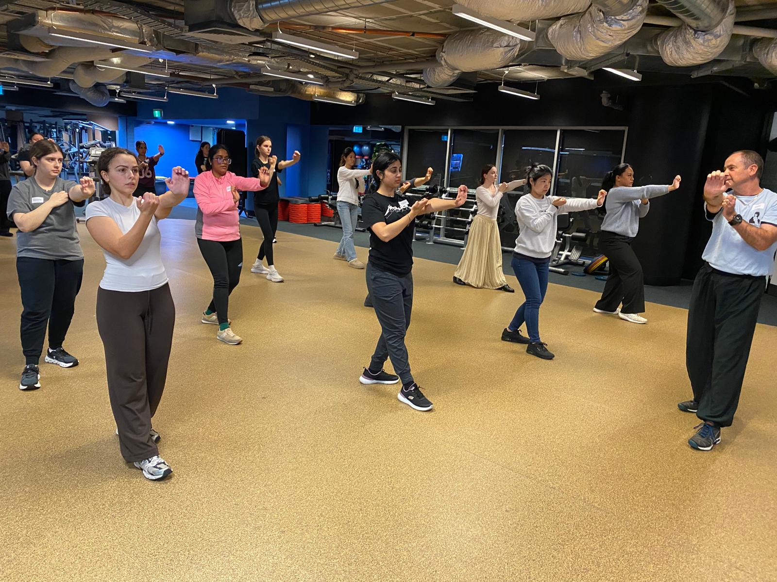 RMIT students performing a self-defence move during a class