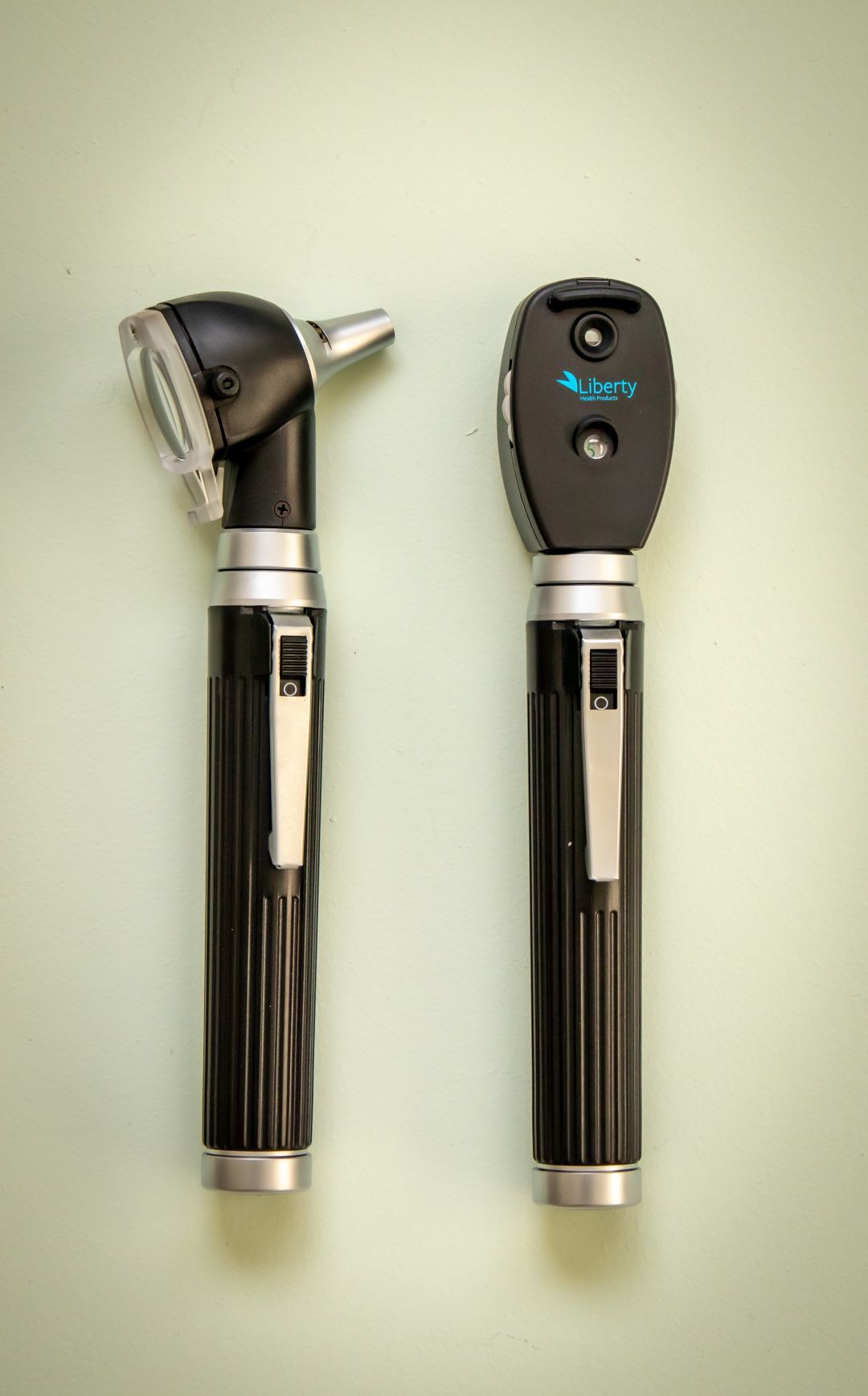RMIT Store Ophthalmoscope & Otoscope Mini Set by Liberty Health Products displayed vertically, highlighting their elegant design and functional details against a light background. Perfect for precise medical examinations.