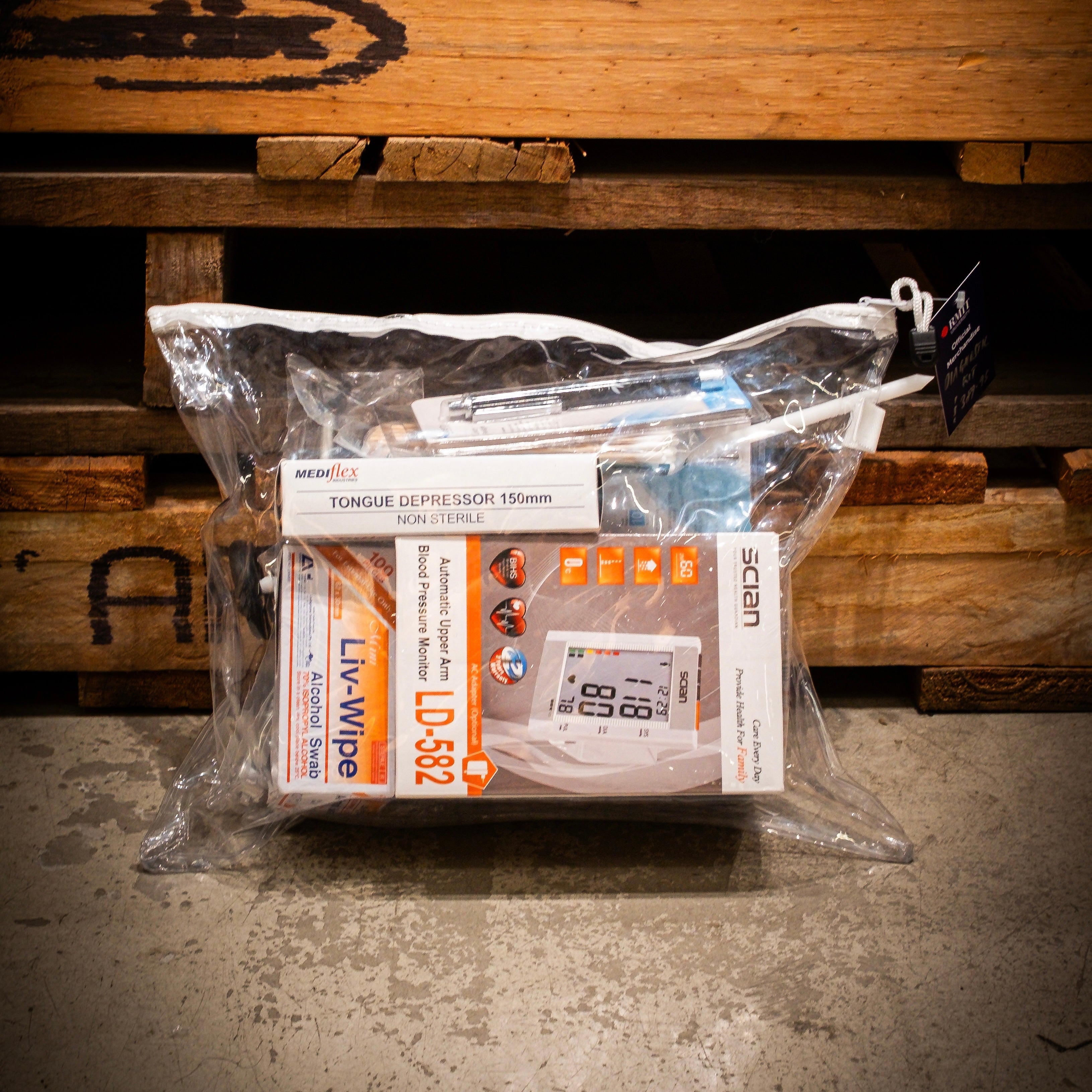 Complete RMIT Store diagnostic kit in a transparent pouch showcasing items like the Tongue Depressor, Scian Blood Pressure Monitor, and various essential diagnostic tools, packed for convenient storage.