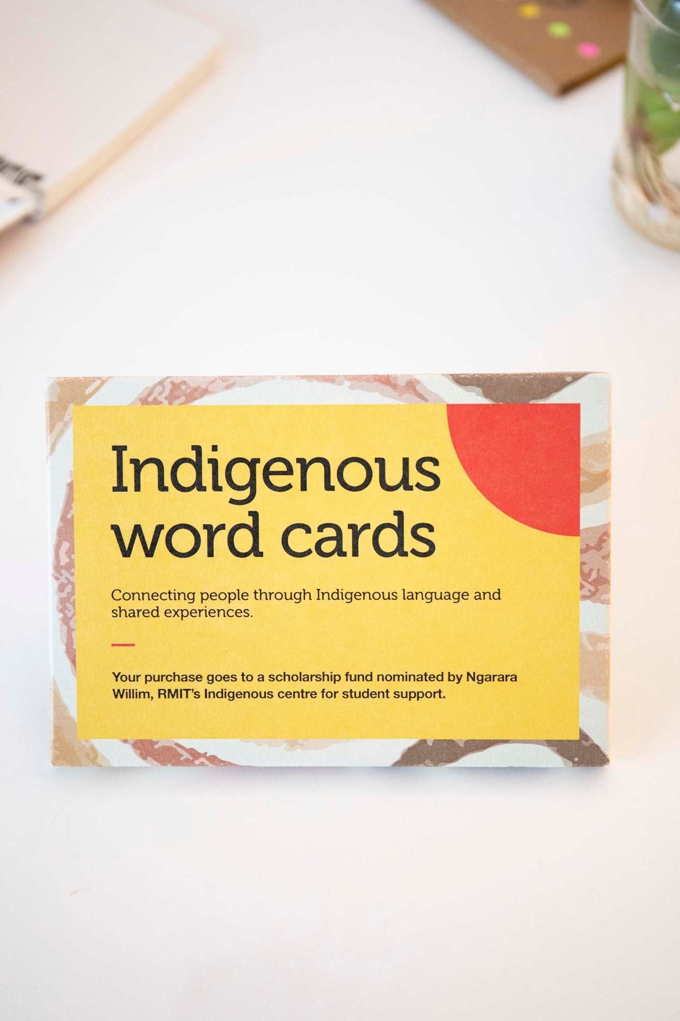 Front cover of the Indigenous Words Cards pack from the RMIT Store featuring "Indigenous word cards" in bold along with "Connecting people through Indigenous language and shared experiences" underneath.