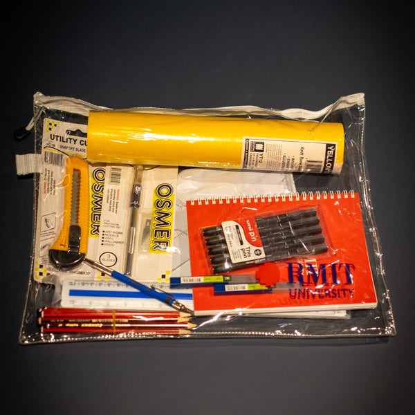 Interior Design and Decoration Kit displayed fully assembled inside a clear zippered storage pouch at RMIT Store, showing Yellowtrace sketch paper roll, red RMIT notebook, black fineliner pens, pencils, mechanical pencil, rulers, utility cutter, precision knife, and assorted drawing tools neatly arranged.