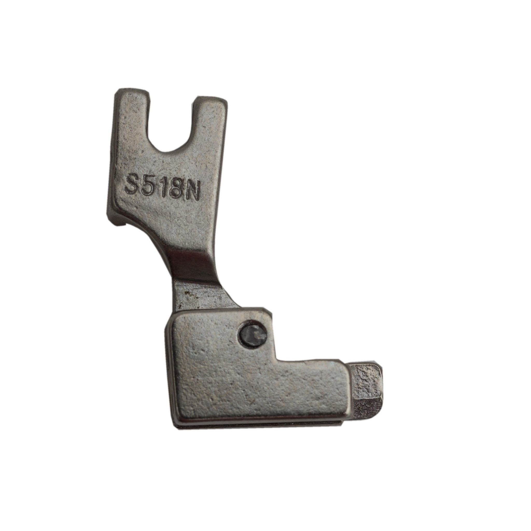 Reverse side close-up of a silver invisible zipper foot attachment, showing a smooth, curved metal surface with a visible engraving marked “S518N.” Available from the RMIT Store.