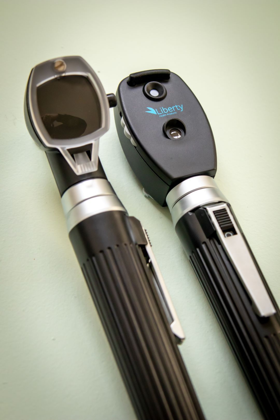 Close-up view of the RMIT Store Ophthalmoscope & Otoscope Mini Set by Liberty Health Products, showcasing their sleek black design with metallic accents. Ideal for medical professionals, these diagnostic tools are compact and portable.