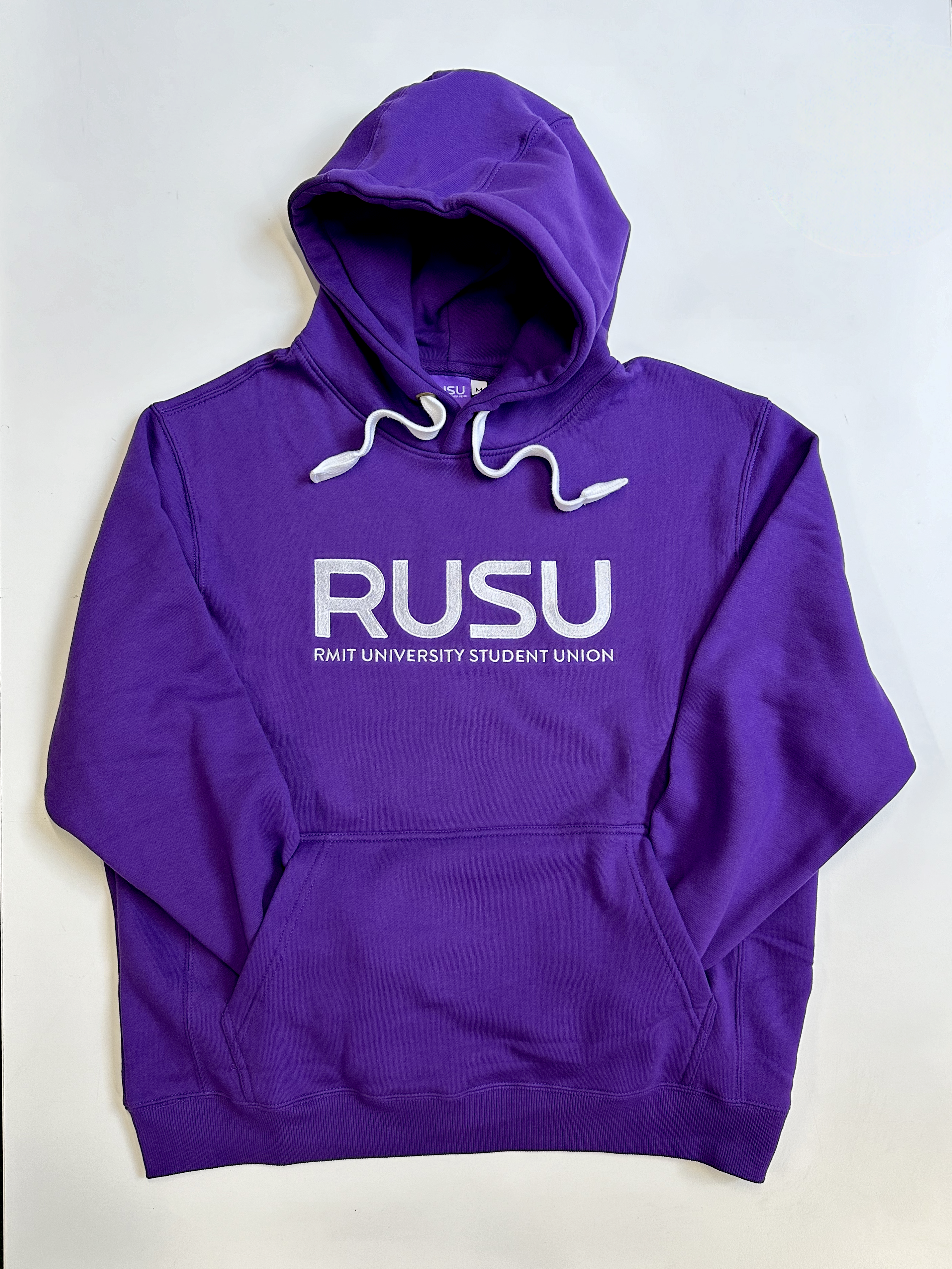 RUSU Hoodie in purple with large embroirdered white RUSU logo in centre chest lying flat.