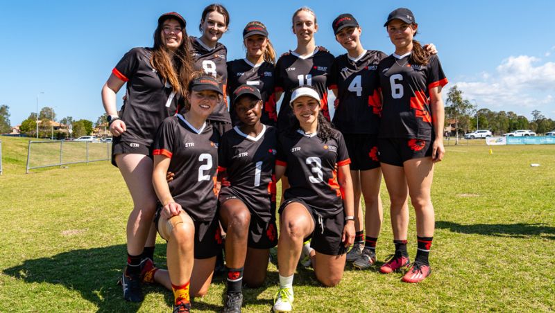 RMIT Univeristy Redbacks team group photo - women standing and kneeling